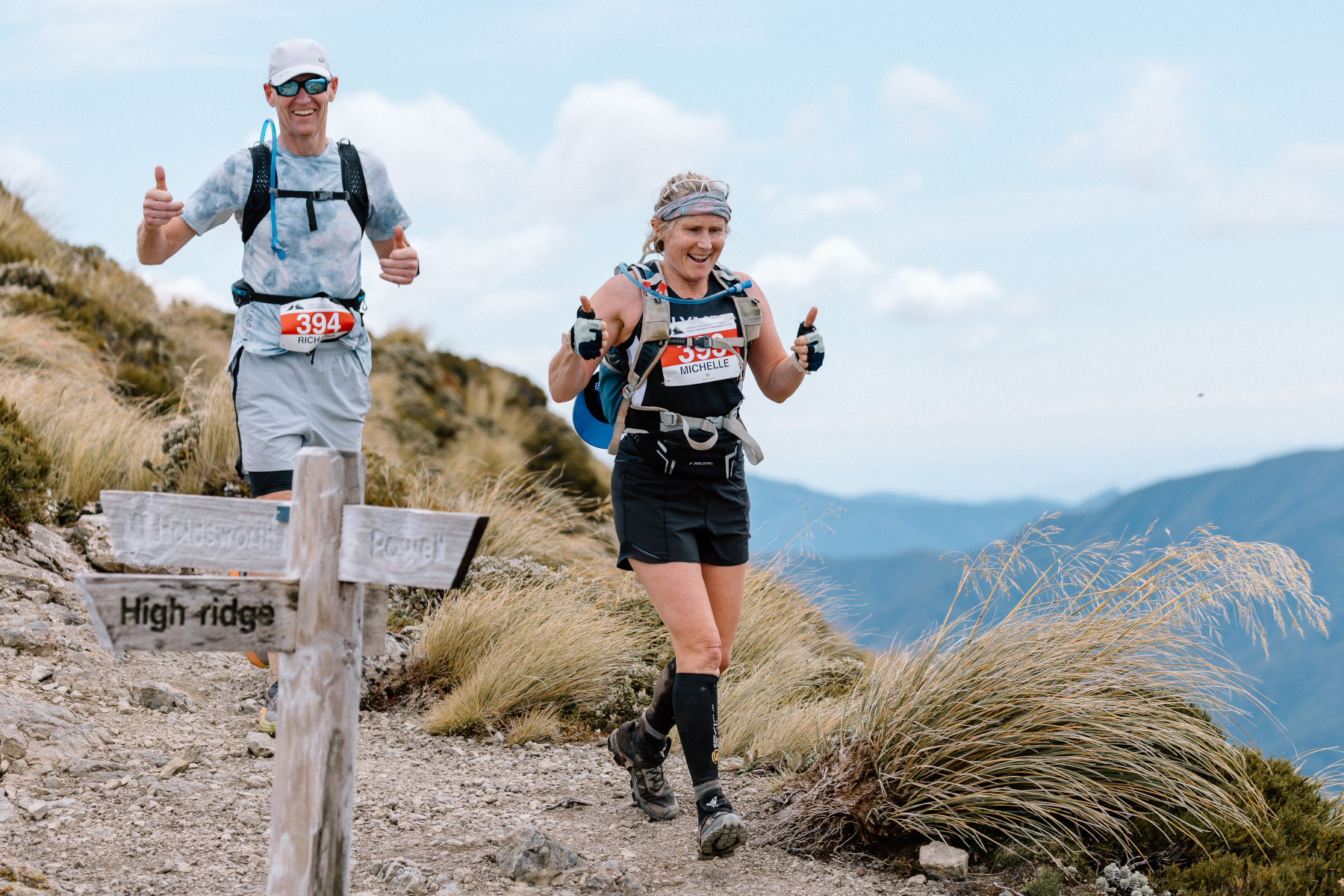 Runner traversing the Jumbo-Holdsworth trail with mountain views